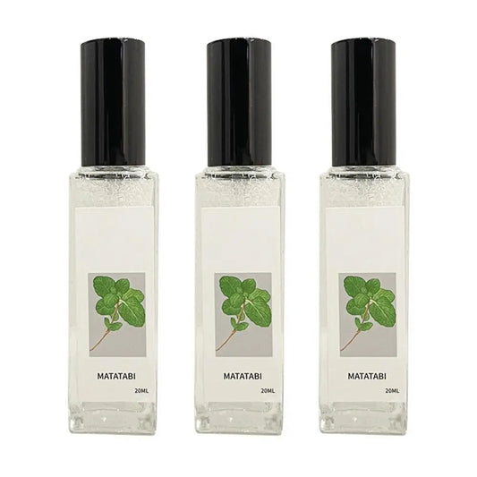 Three Matatabi perfume bottles with black caps on a white background