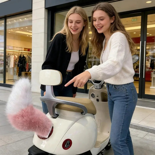Two women interacting with a small scooter-like vehicle with a fluffy pink attachment in an urban setting.
