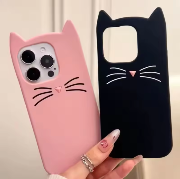 Pink and black cat-shaped phone cases held by a hand with a neutral background