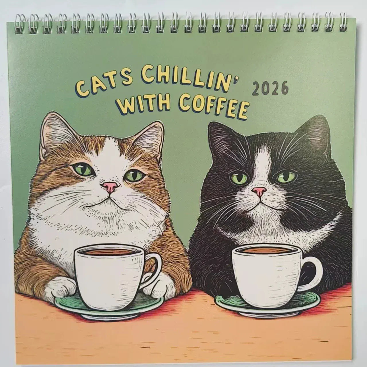 Calendar cover with two cats and coffee cups, titled 'Cats Chillin' with Coffee 2026'.