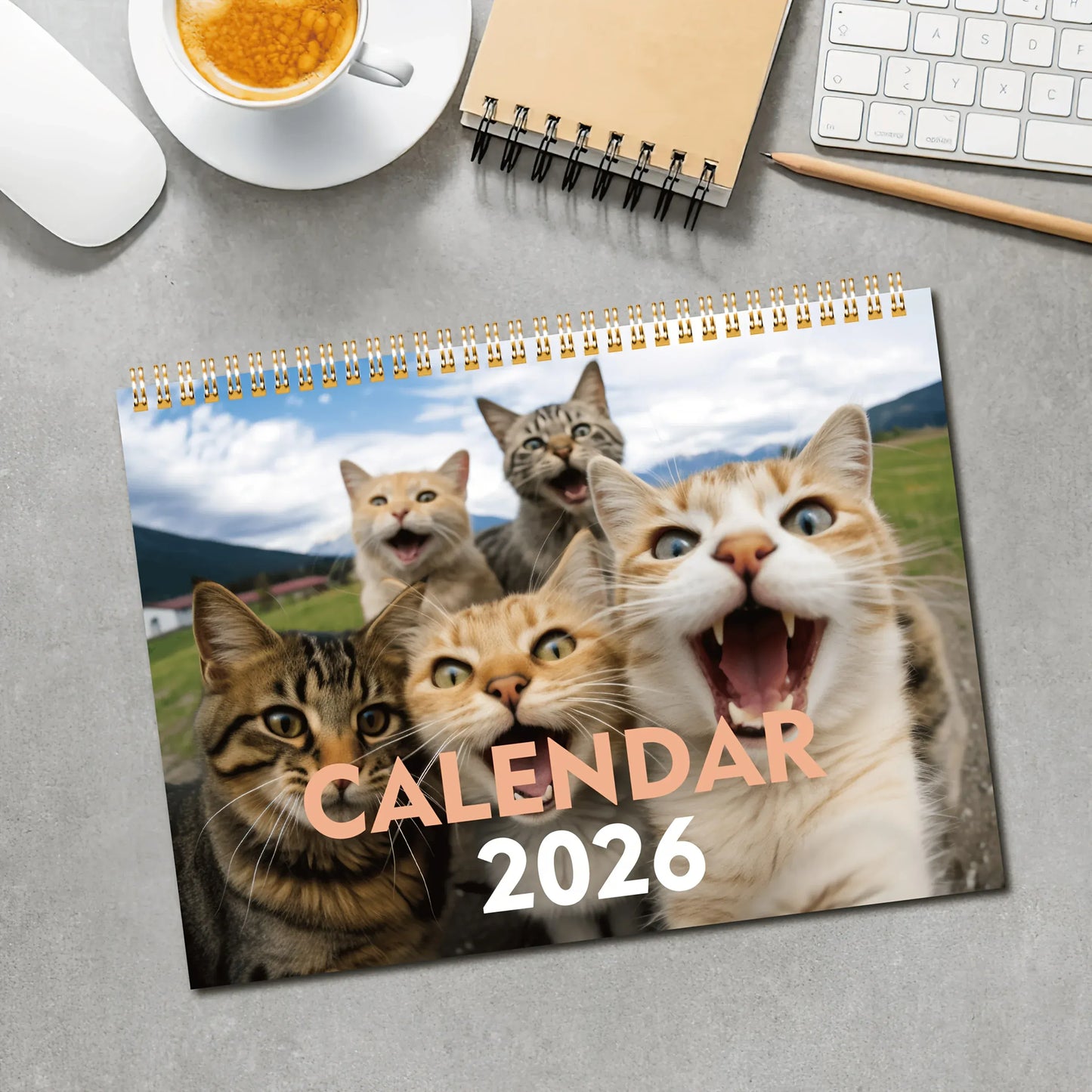 Calendar 2026 with cat images on a desk with office supplies