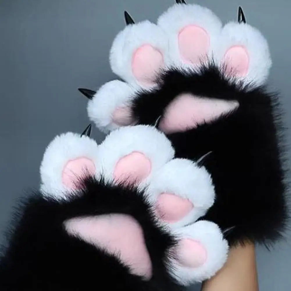 Black and white cat paw claw gloves with pink inner pads, shown being worn on hands against a plain gray background.