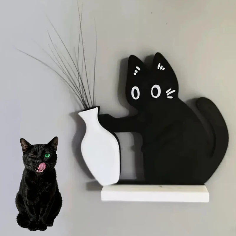 Black cat figurine interacting with a white vase on a shelf against a plain wall.