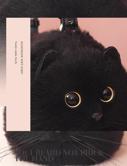 Black cat plush toy purse with gold eyes on a pink background