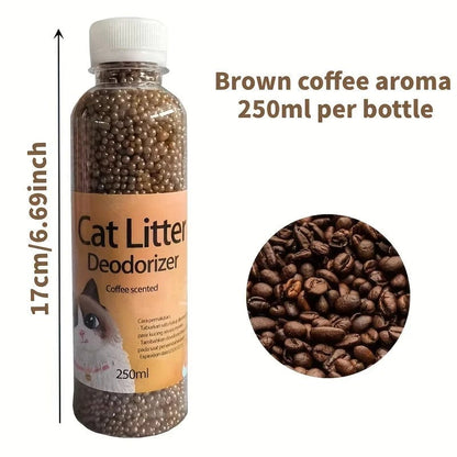 Bottles of Cat Litter Deodorant Beads in various colors with a plate of beads in green, indicating a natural scent. A cat is present in the background, suggesting the product's use in a home environment.