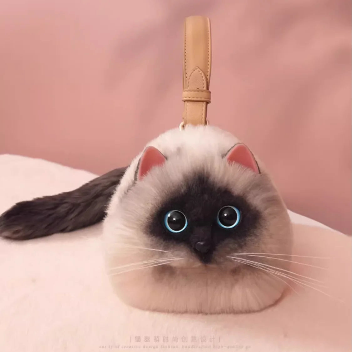 Cat-shaped design bag on a pink background