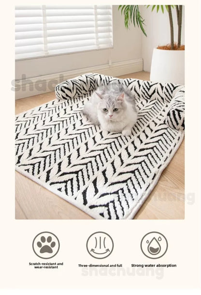 Cat lying on a black and white patterned rug with product features displayed below.