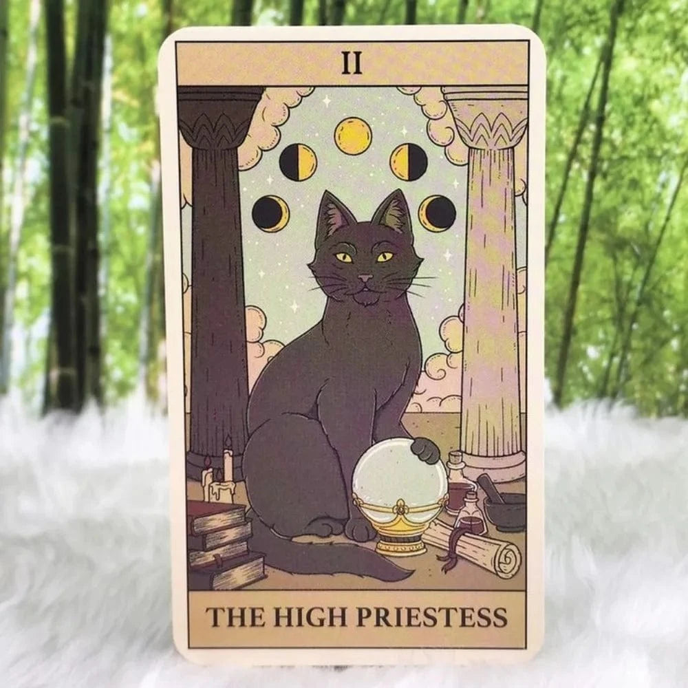 A tarot card featuring a whimsical illustration of a cat with a moon and stars motif, titled 'The High Priestess'.