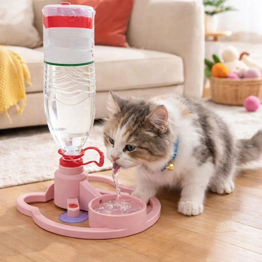 Cat drinking water from a pink pet fountain in a living room.
