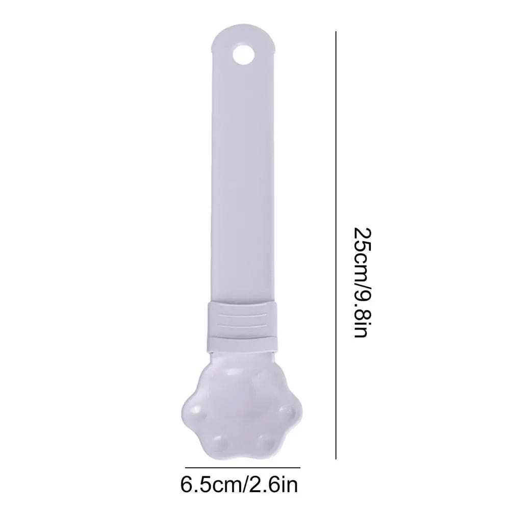A Cat Strip Squeezer Treat Spoon in white