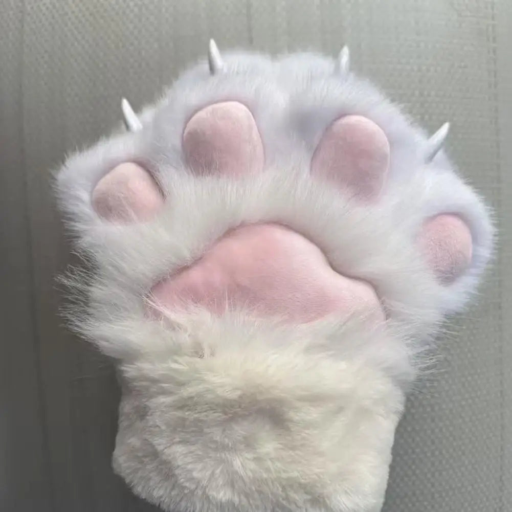 Close-up of a fluffy cat paw with pink pads on a neutral background