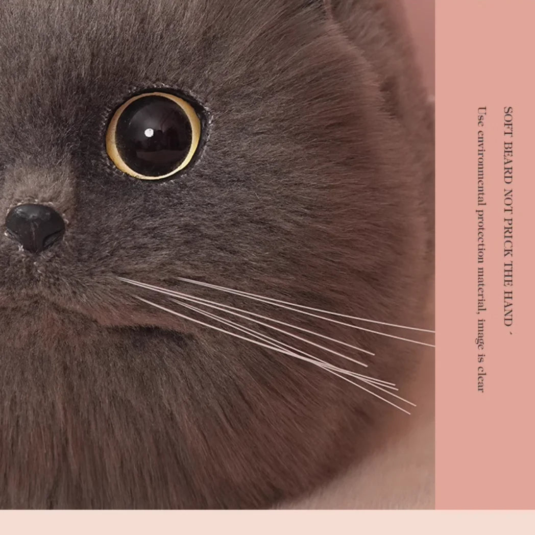 Close-up of a gray cat's face handbag with a pink border and text.