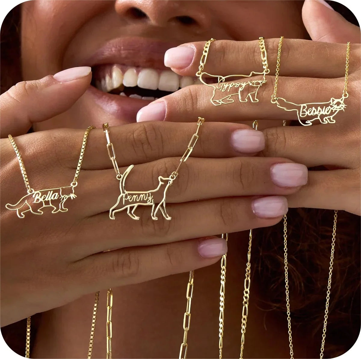 Gold pet name necklaces and rings displayed on a person's hand.
