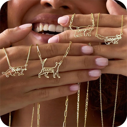 Gold pet name necklaces and rings displayed on a person's hand.