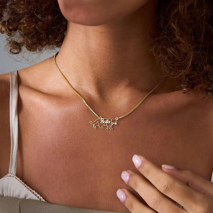 Gold necklace with a dog tag on a person's neck