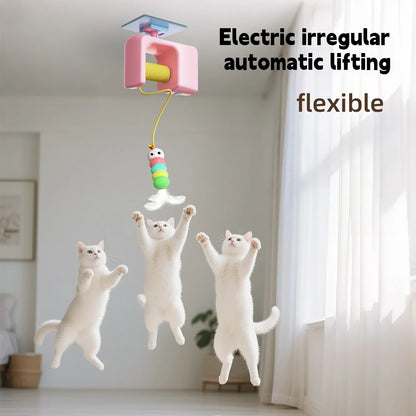 Electric cat toy with colorful fish-shaped lure attracting three white cats in a room.