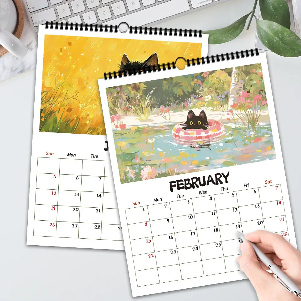 Calendar with cat illustrations on a desk with a pen and coffee cup.