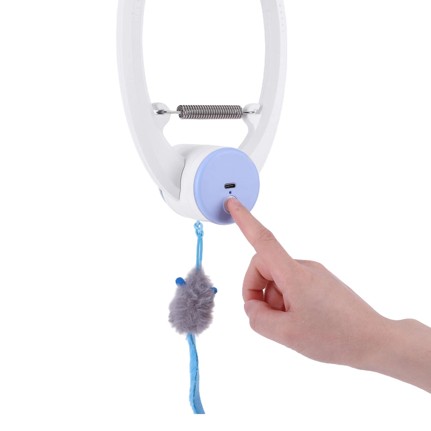 Hand pressing a button on a white and blue device with a dangling gray object against a white background