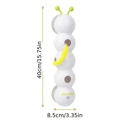 White toy with green antennas and yellow accents, showing dimensions on a white background