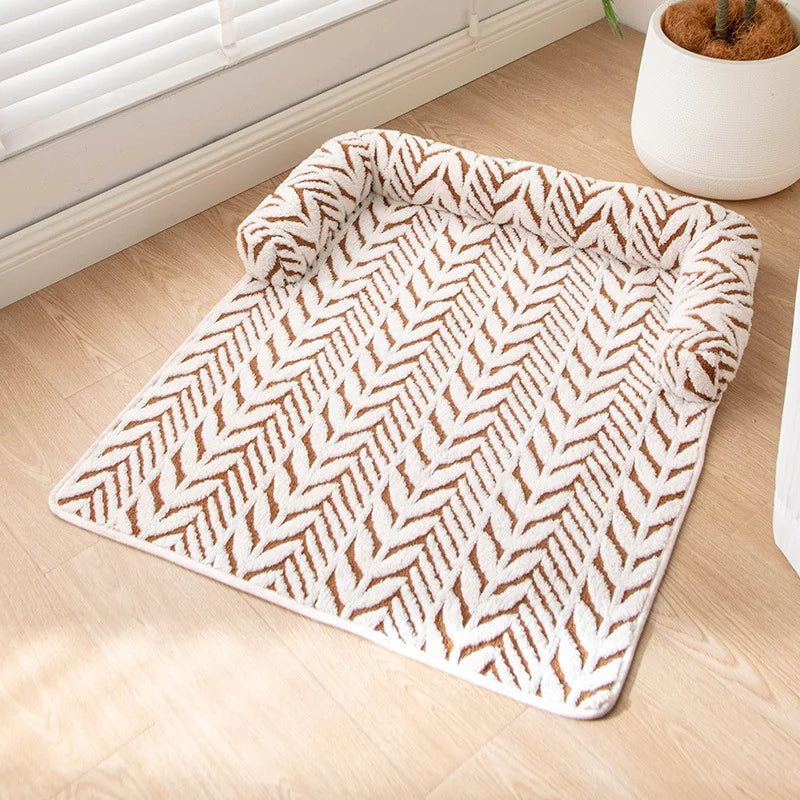 Patterned rug on a wooden floor with a plant in the background
