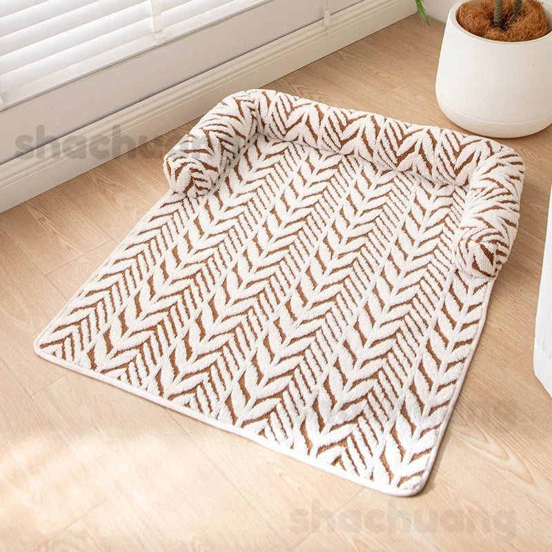 Patterned rug on a wooden floor with a plant in the background