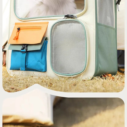 Pet carrier with orange and blue compartments on a soft surface