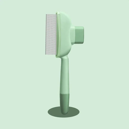 Green pet grooming brush on a light green background