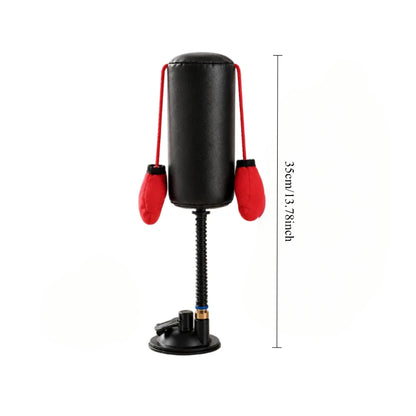 Black and red punching bag with stand on a white background