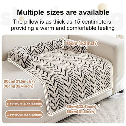 Patterned blanket on a sofa with size measurements displayed