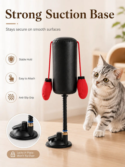 Cat toy with strong suction base and cat interacting with it on a table.