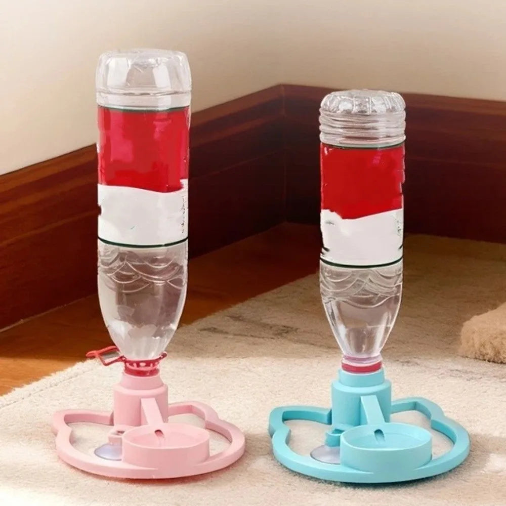 Two pet water bottles with stands, one pink and one blue, on a carpeted floor.