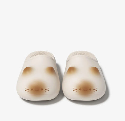 Pair of cute animal-shaped slippers on a white background