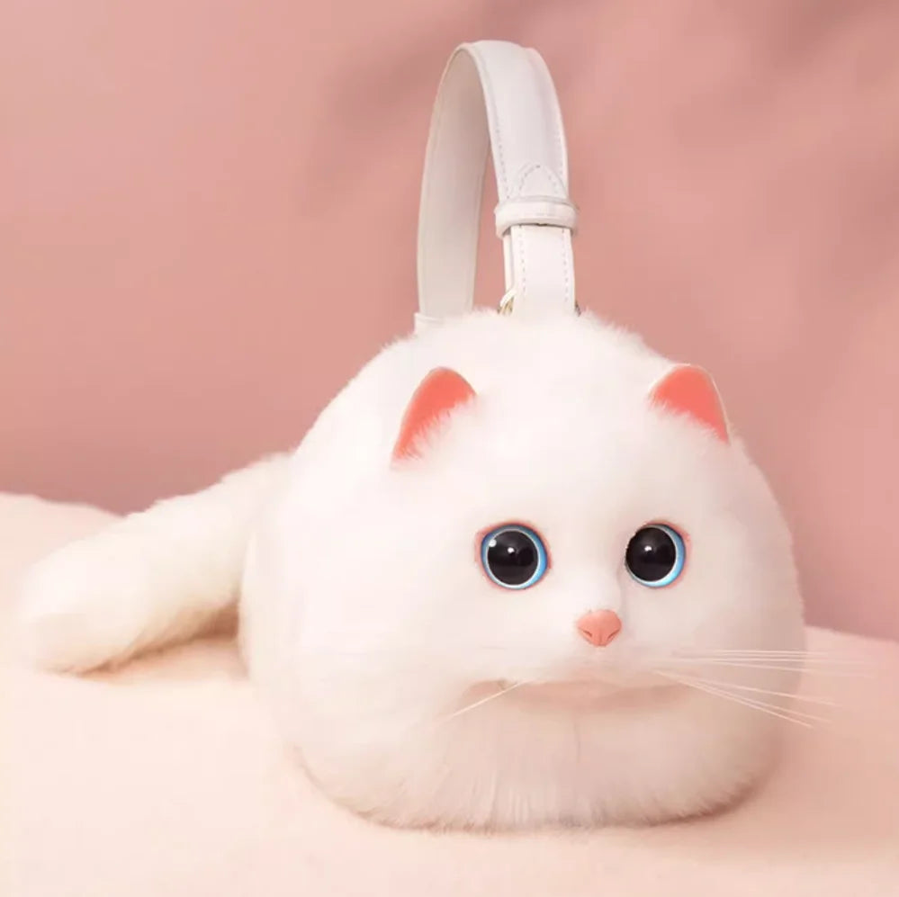 White cat-shaped plush toy with pink accents bag on a pink background