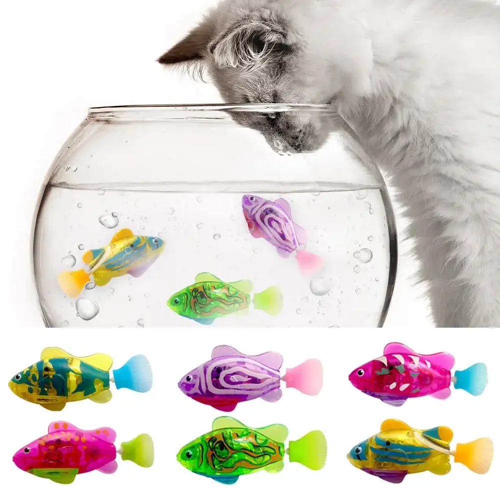 A selection of colorful cat electric fish water toys swimming in a bowl of water, with a white cat watching.