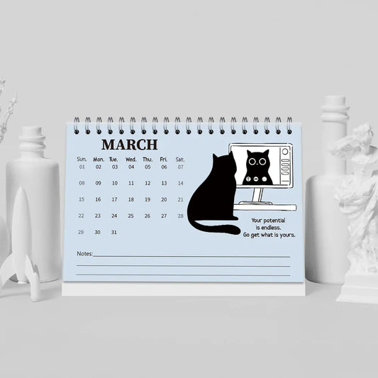 Calendar with a cat design on a light blue background, featuring the month of March.