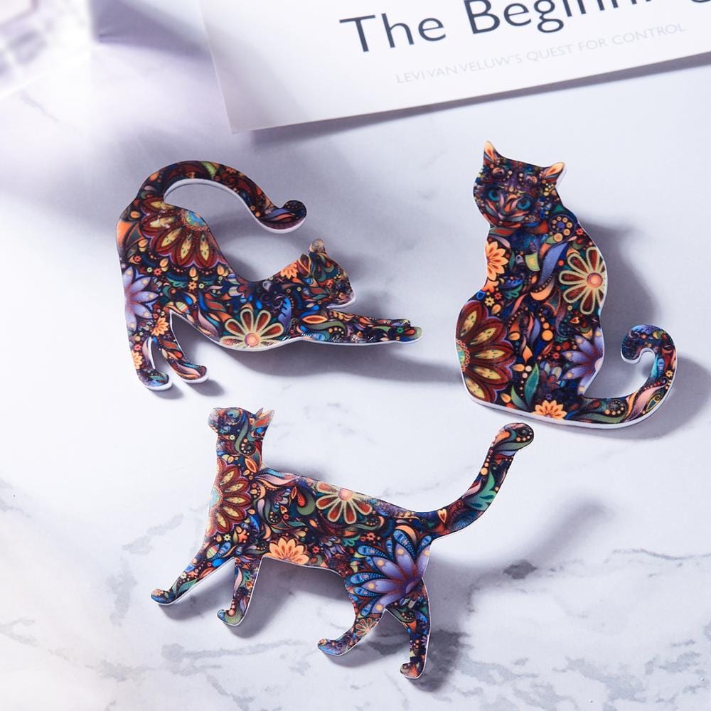 Backpack cat brooch featuring a beautiful multicolor floral pattern