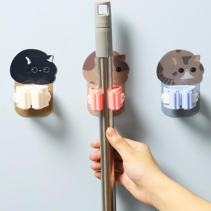 Wall organization with adhesive cat hanger