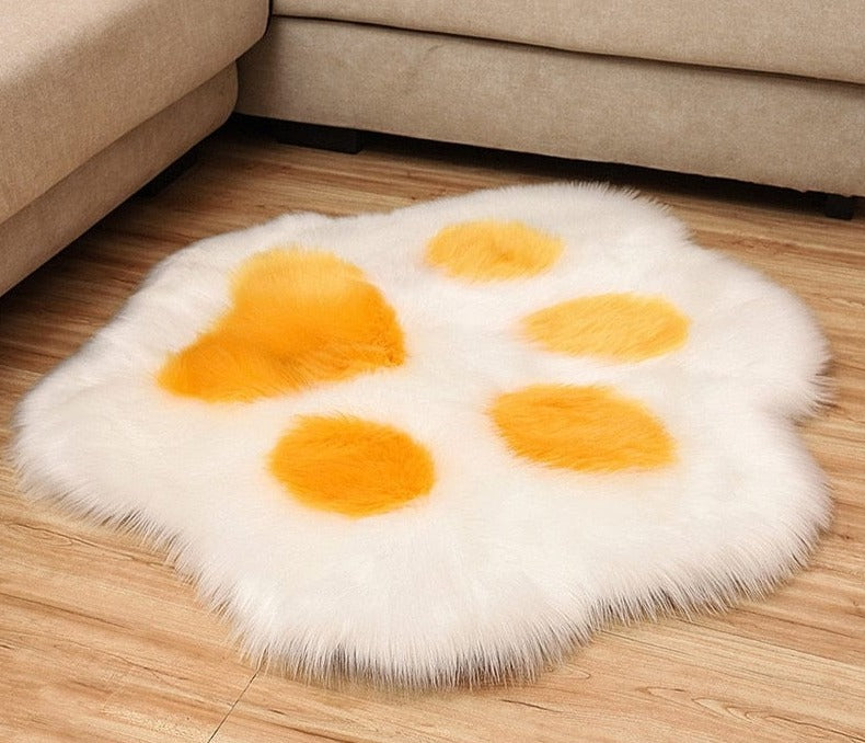 Cozy cat paw-shaped cushion rug for added comfort