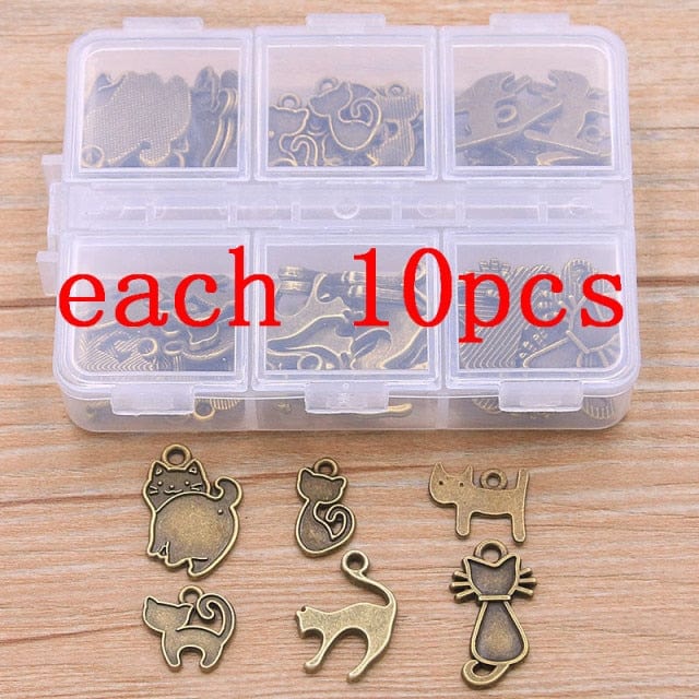Assorted cat pendants in a box